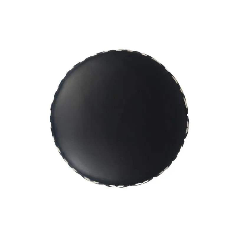 Top view of the ottoman showing its black cushioned seat