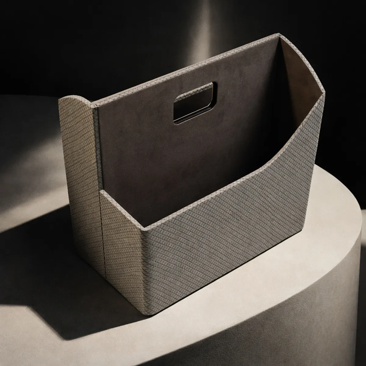 Grey desk organiser shown empty, with a built-in rectangular handle