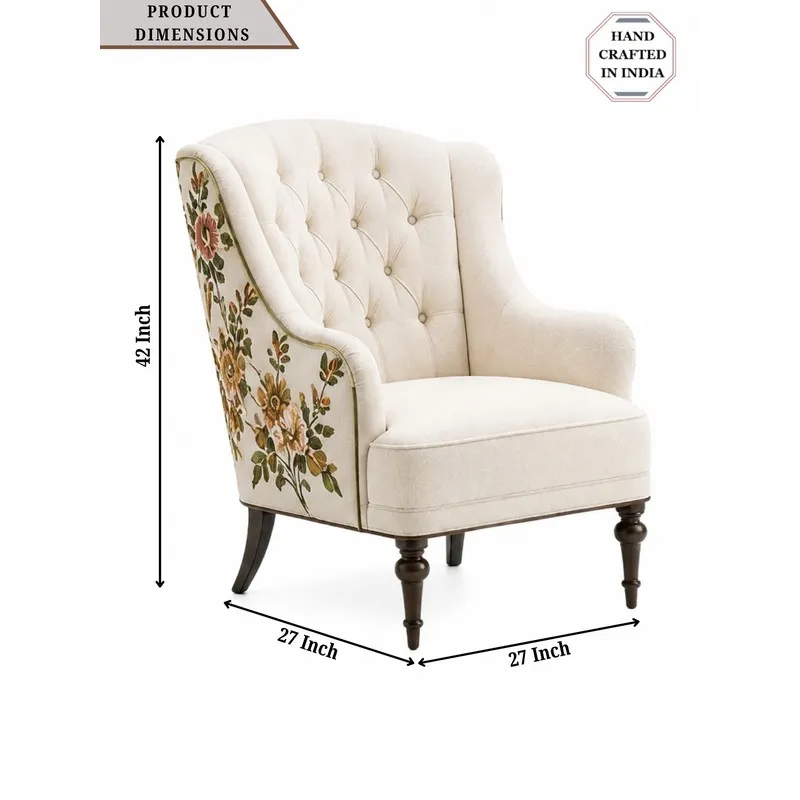 Cream lounge chair with floral embroidered sides shown in angled view
