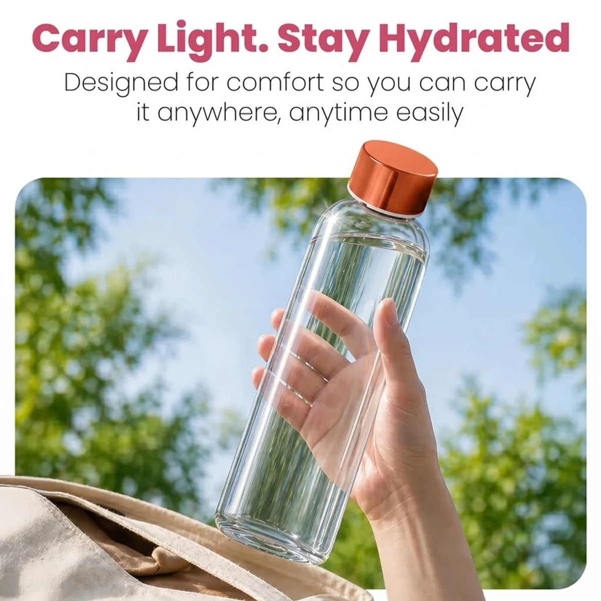 Hand holding a clear glass bottle outdoors against a blue sky