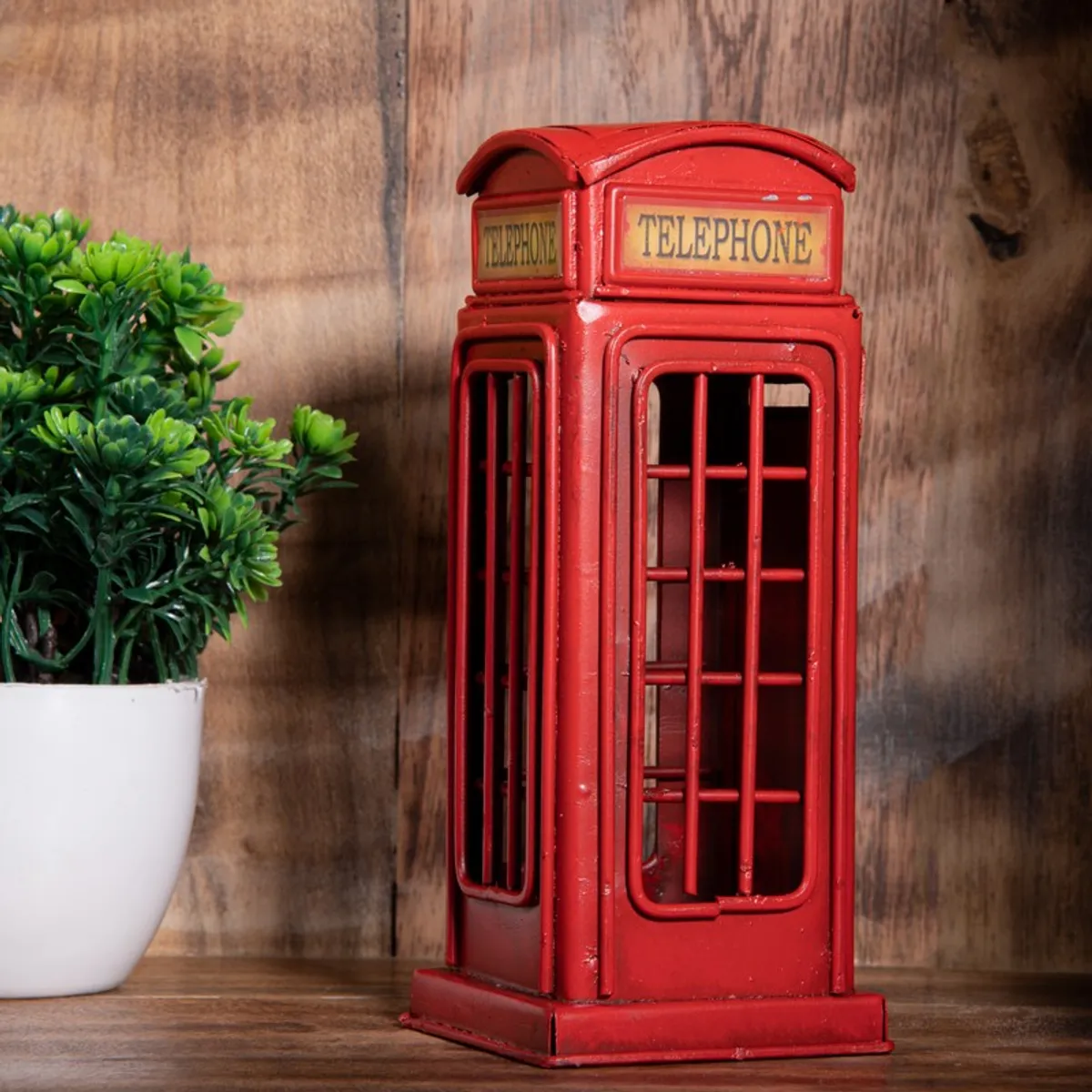 Angled view of a red telephone booth style showpiece