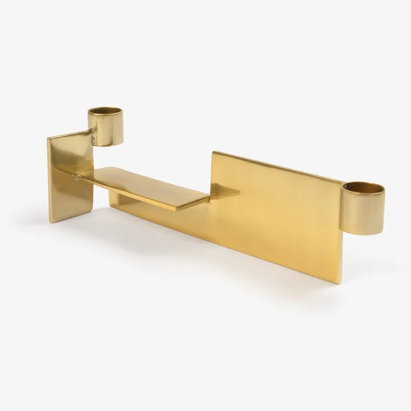 Side view of gold dual candle holder with two candle sockets