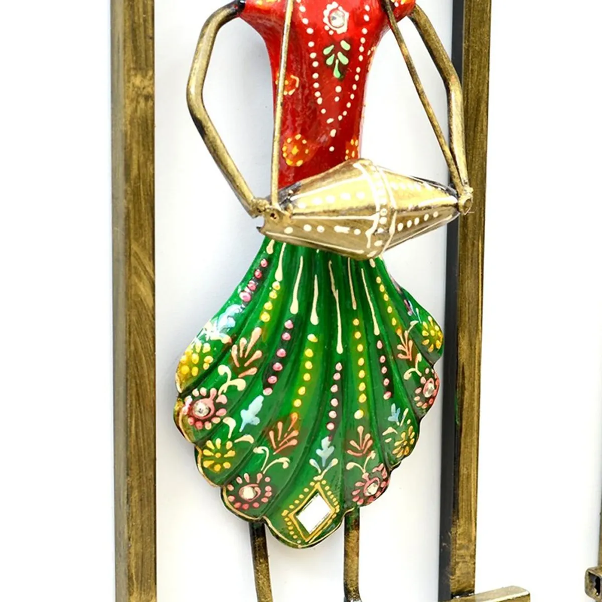 Close-up of a green and red hand-painted musician wall accent