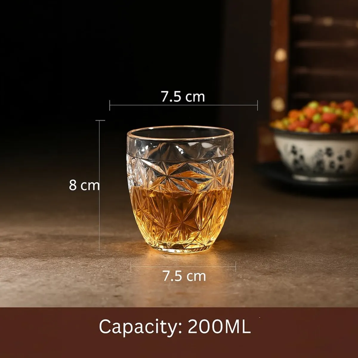 Clear textured whiskey glass with amber drink shown with capacity graphic