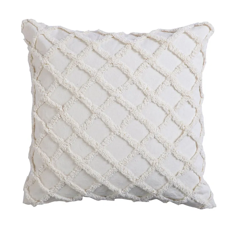 Single white cushion cover with tufted diamond pattern on a plain white background.