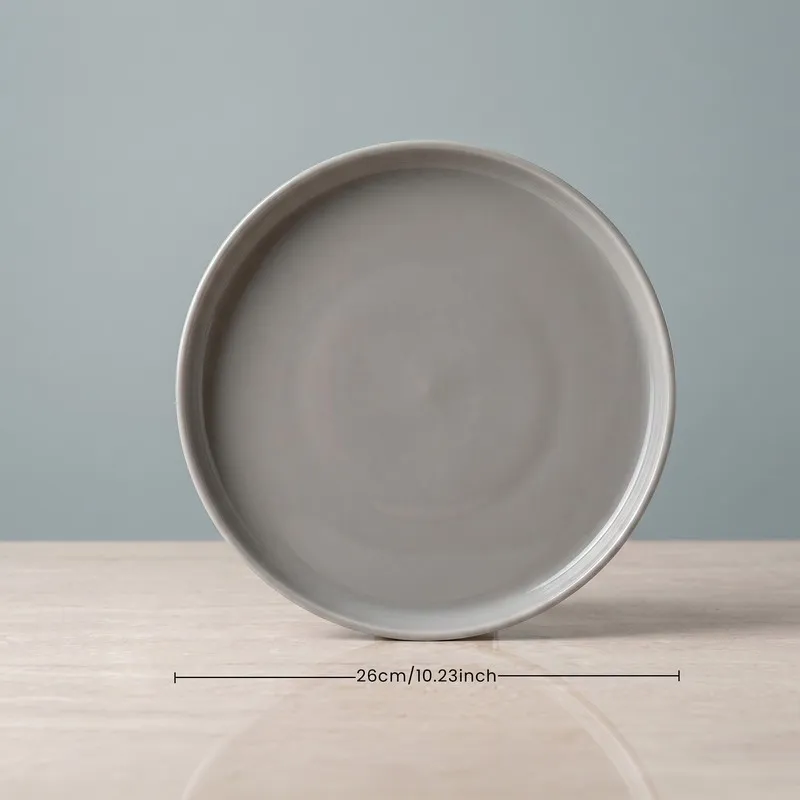 Single grey dinner plate with a subtly glossy finish