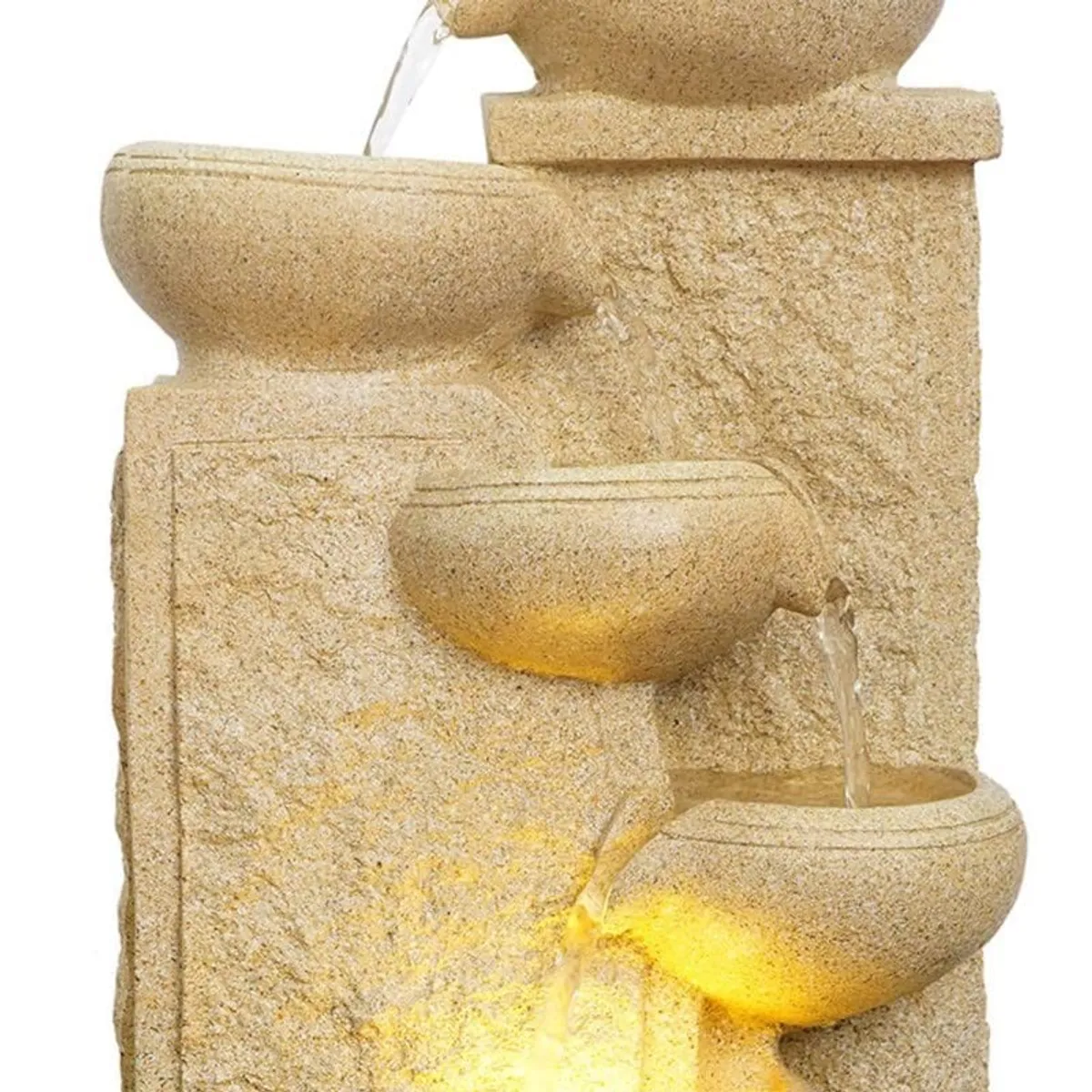Close-up of the textured ivory bowls and warm LED glow in the fountain