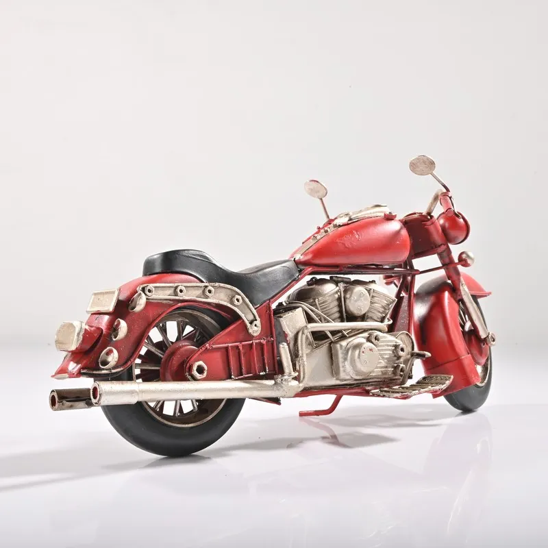 Rear angled view of red and silver motorcycle showpiece on white background