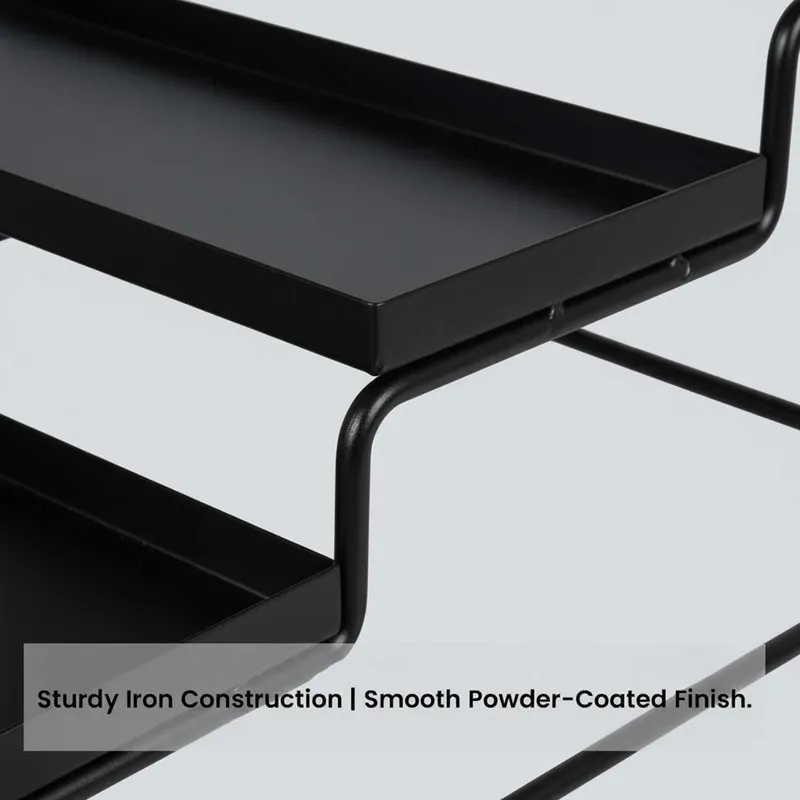 Close-up of the black metal organiser showing its tray edge and frame.