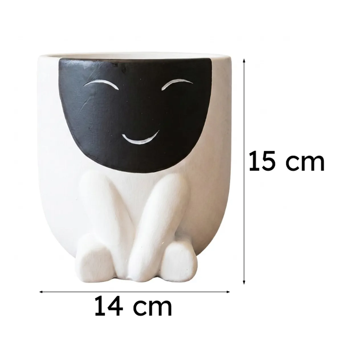 White ceramic planter with black smiling face and sculpted body on plain background