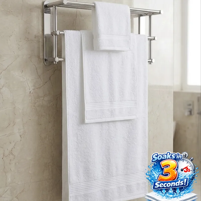 White towels on a bathroom rack with absorbency graphic