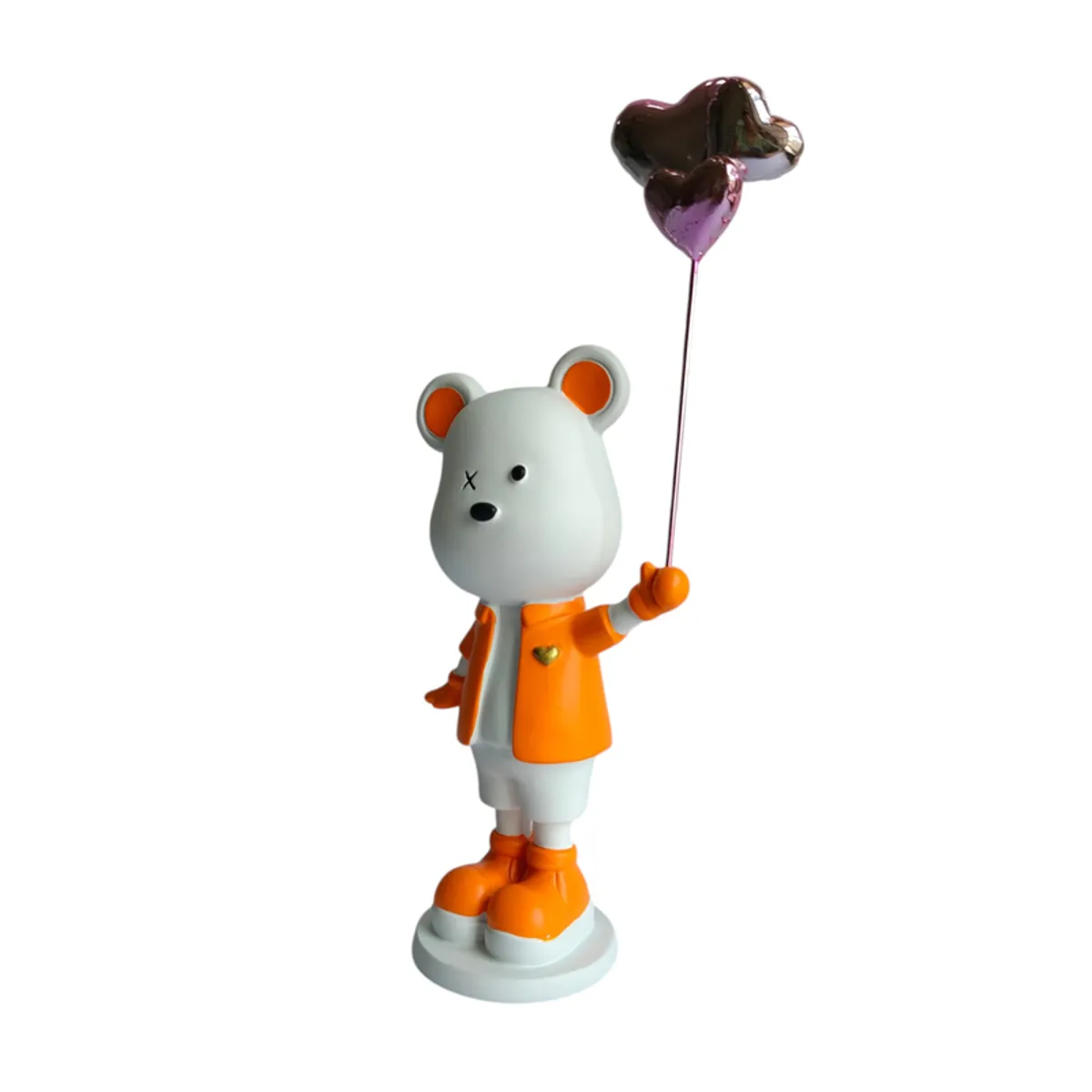 Side profile of the bear figurine holding a metallic balloon