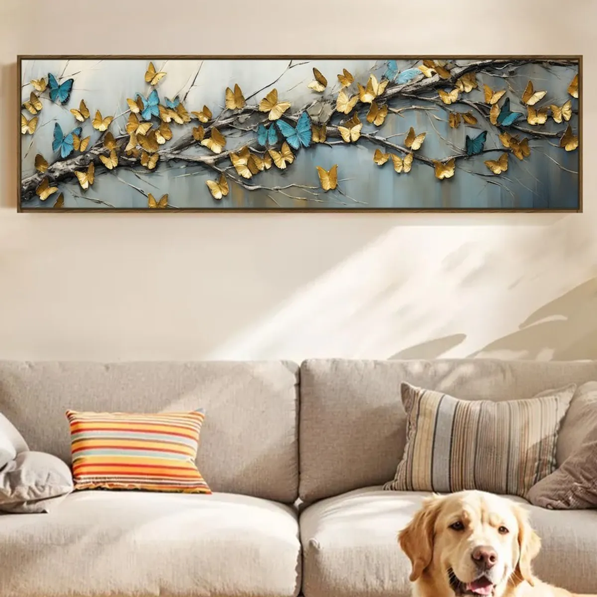 Gold and blue butterfly canvas art above a beige sofa with a dog