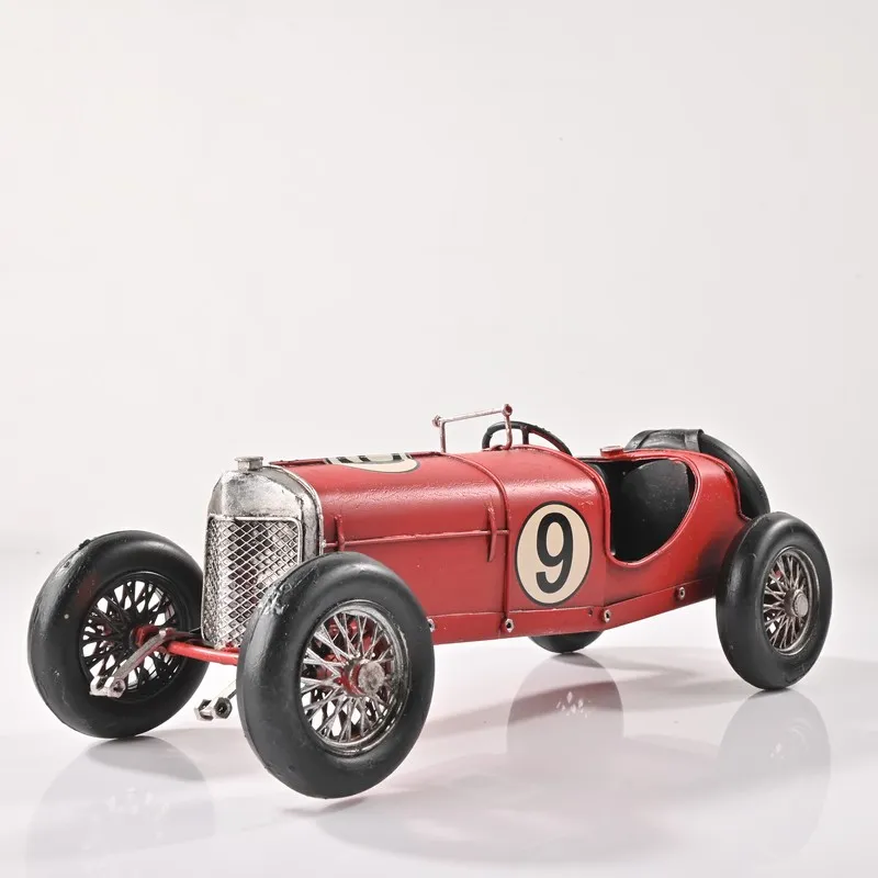 Front angled view of the red vintage race car showpiece