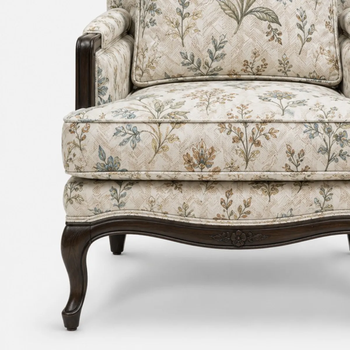 Close-up of floral upholstery and dark curved wooden chair frame