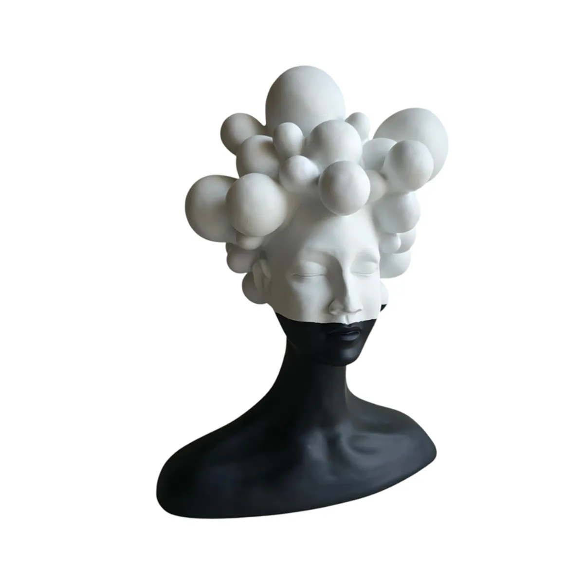 Close-up of the white bubble-like hair and closed eyes of the bust showpiece