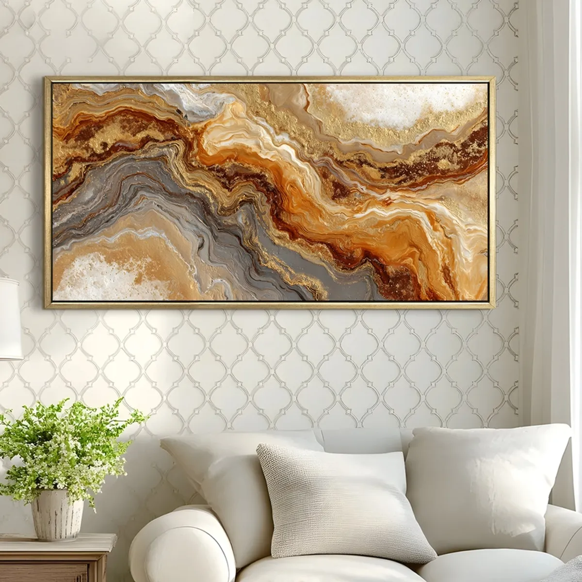 Gold-framed abstract wall painting displayed above a white sofa