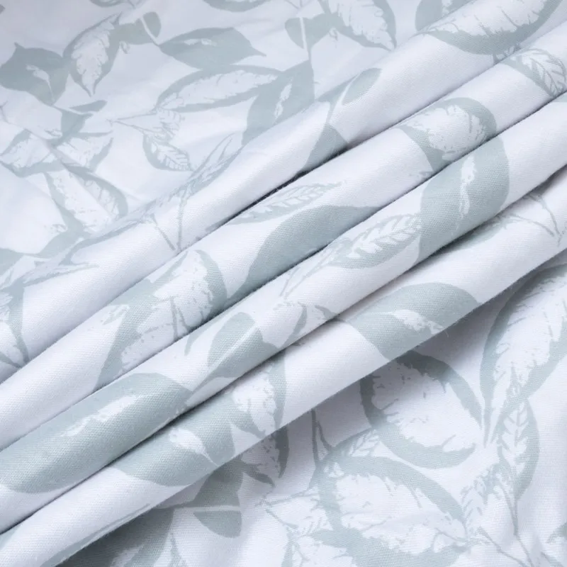 Close-up of the white dohar with pale green leafy print.