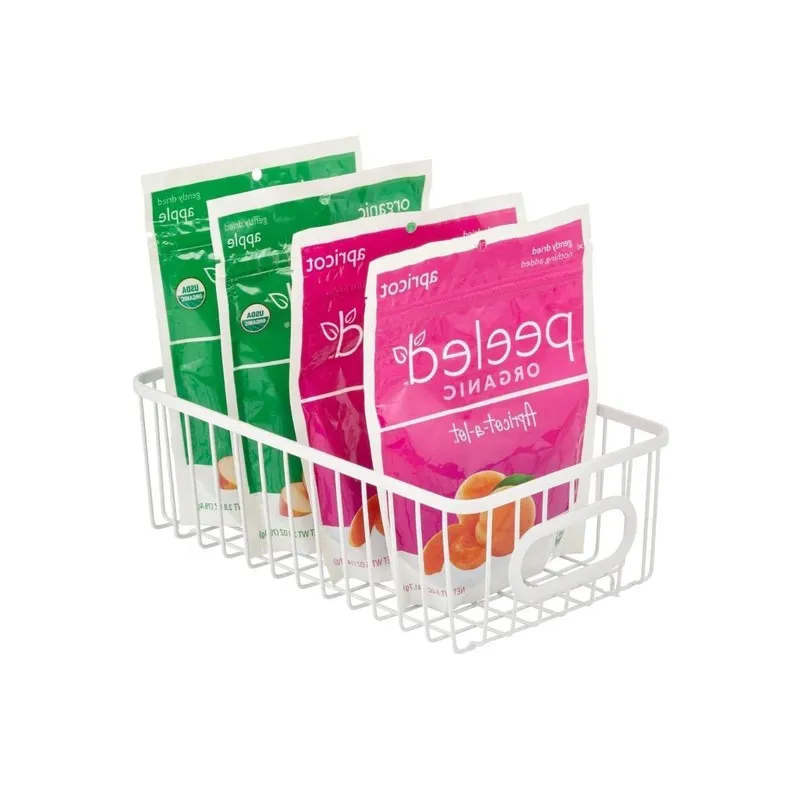 White rectangular wire storage basket holding stand-up pouches