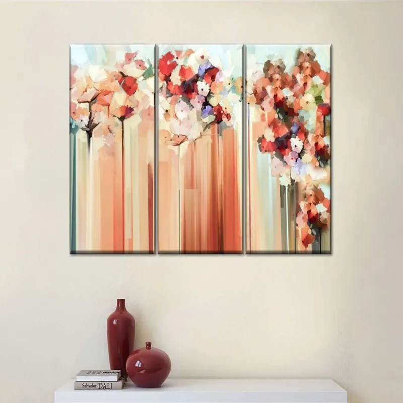 Three rectangular abstract floral canvas paintings displayed together