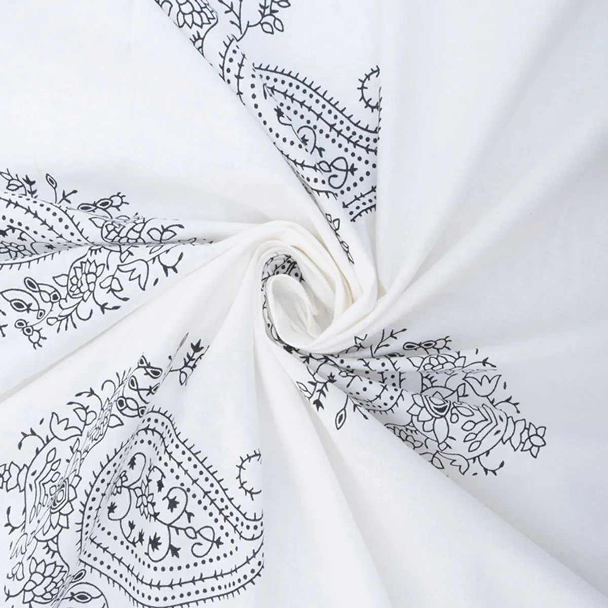 Close-up of white fabric with black botanical paisley detailing
