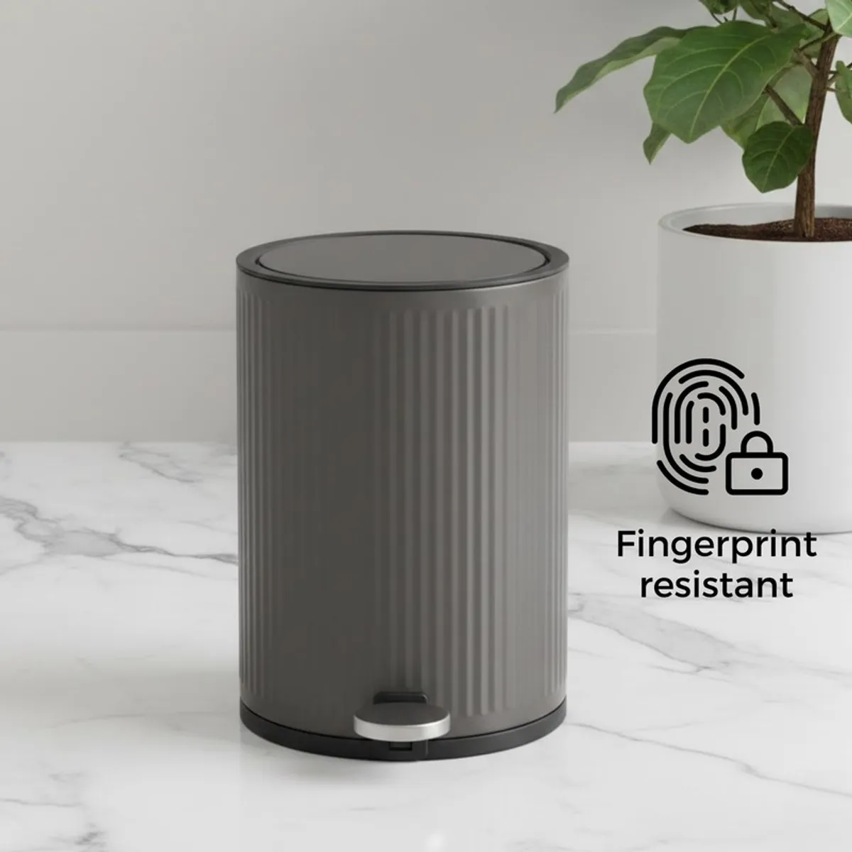Grey ribbed cylindrical dustbin with closed black lid