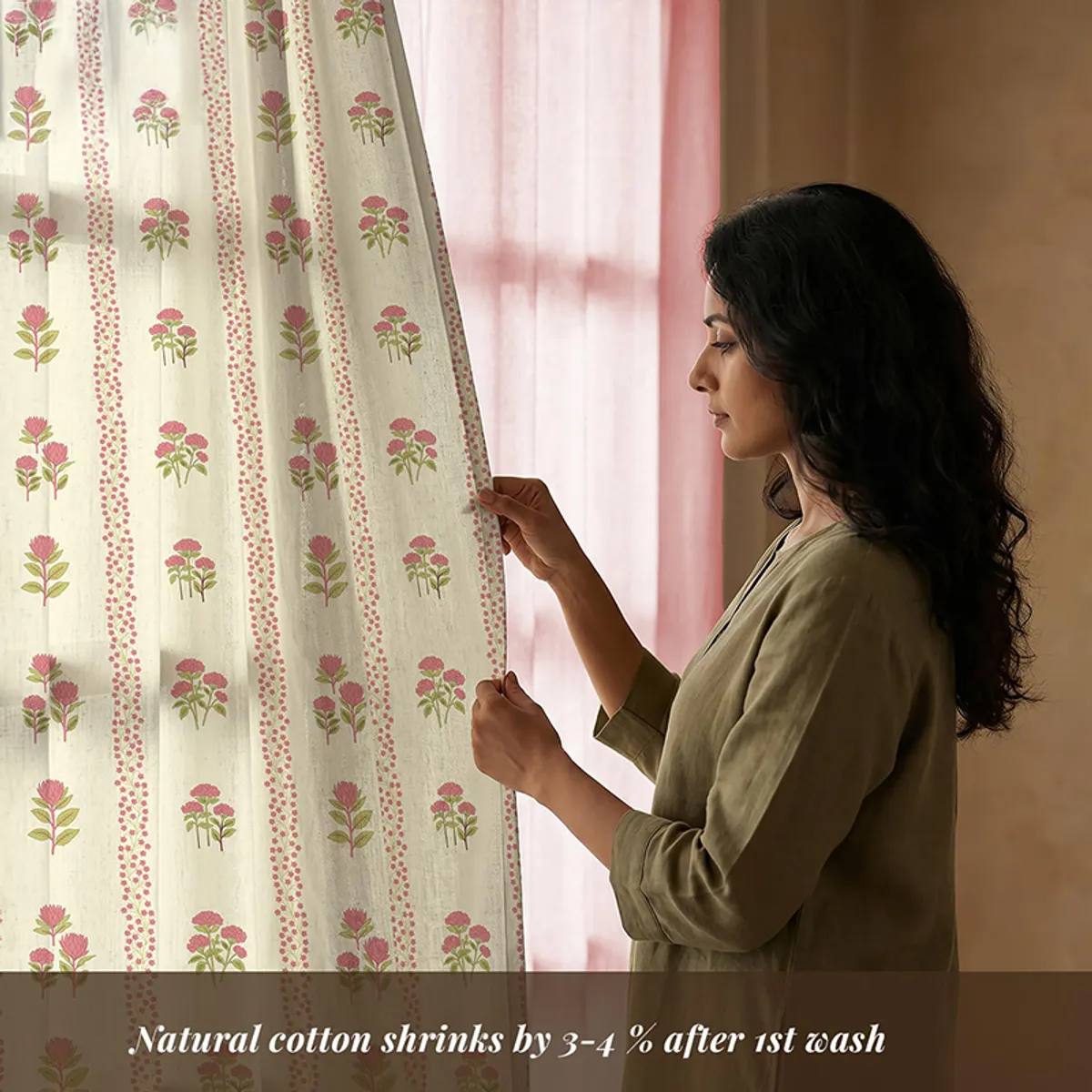 Pink and white floral curtain panels shown with a decorative patterned design.