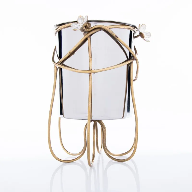 Silver and gold floral ice bucket shown against a white background