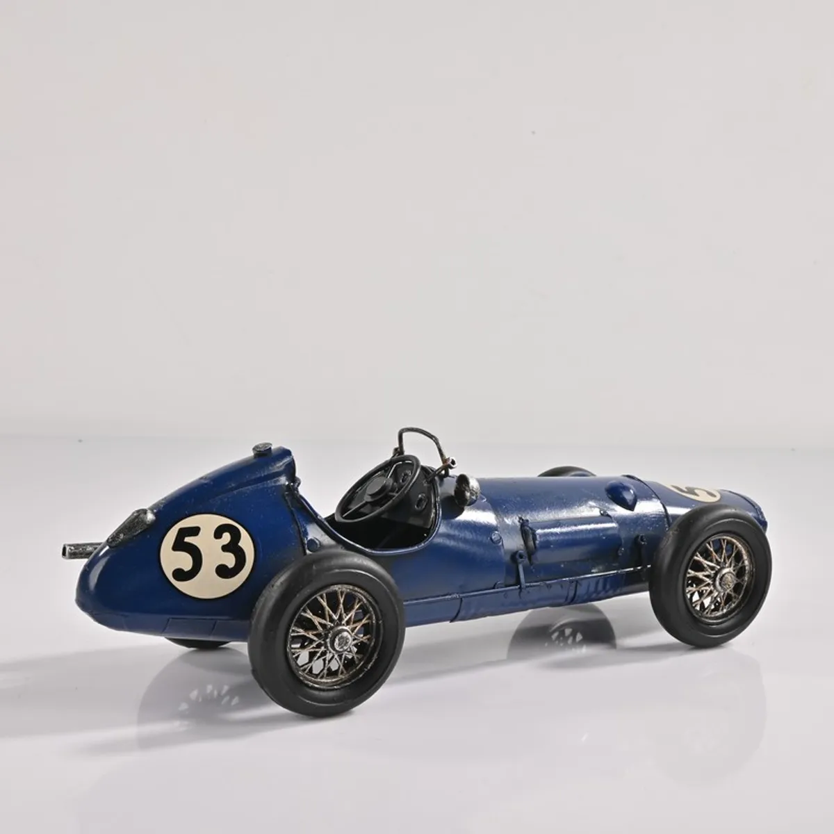 Rear angled view of blue racing car decorative showpiece