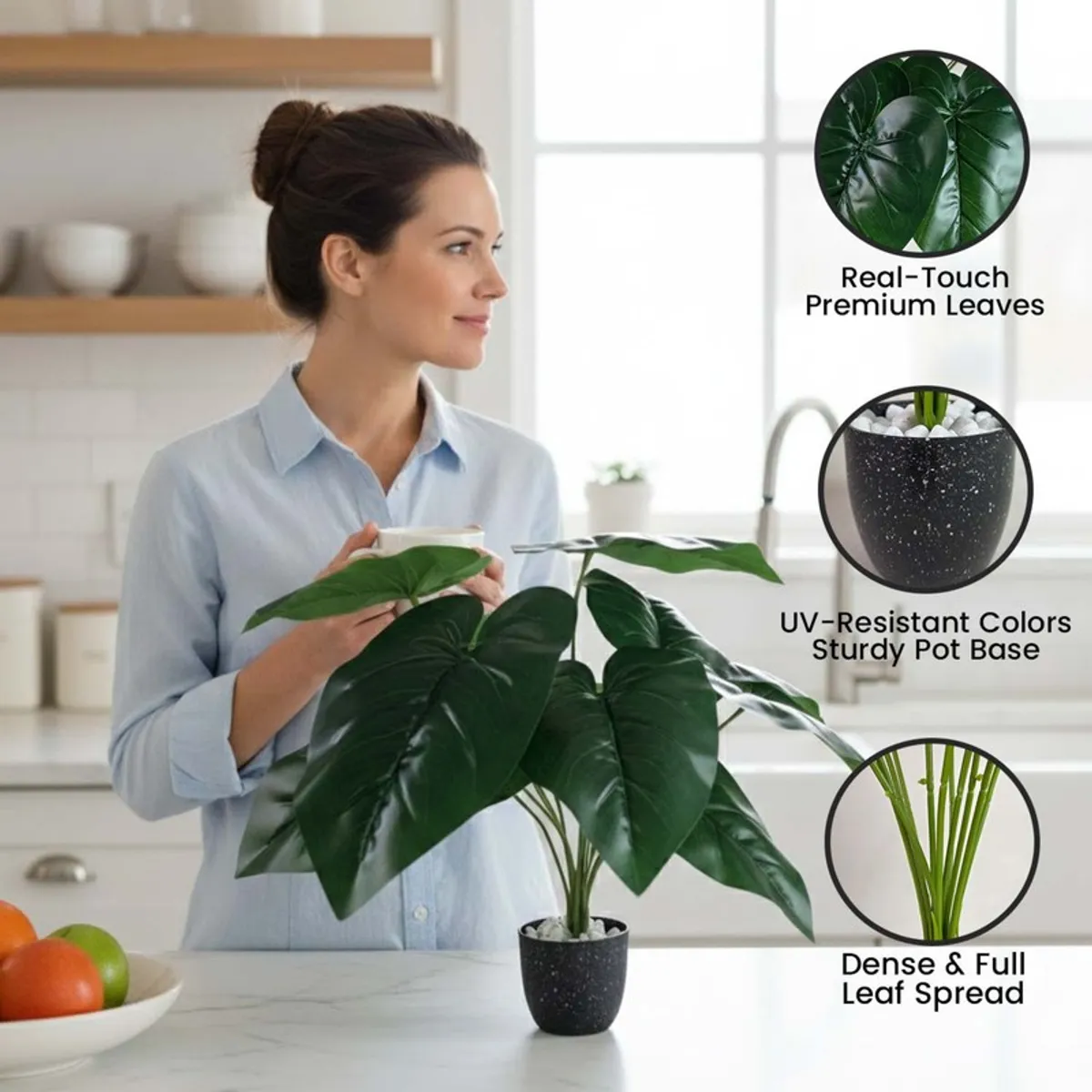 Faux green leafy plant in a black pot shown in a bright home setting.