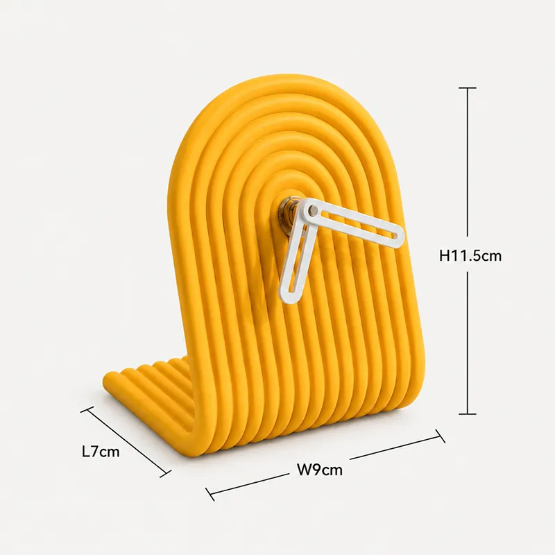 Yellow arched ribbed table clock with white hands on a plain background