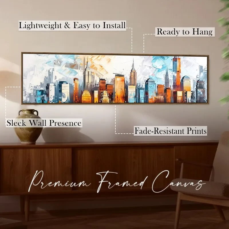 Framed panoramic skyline artwork displayed above a wooden console in warm light.