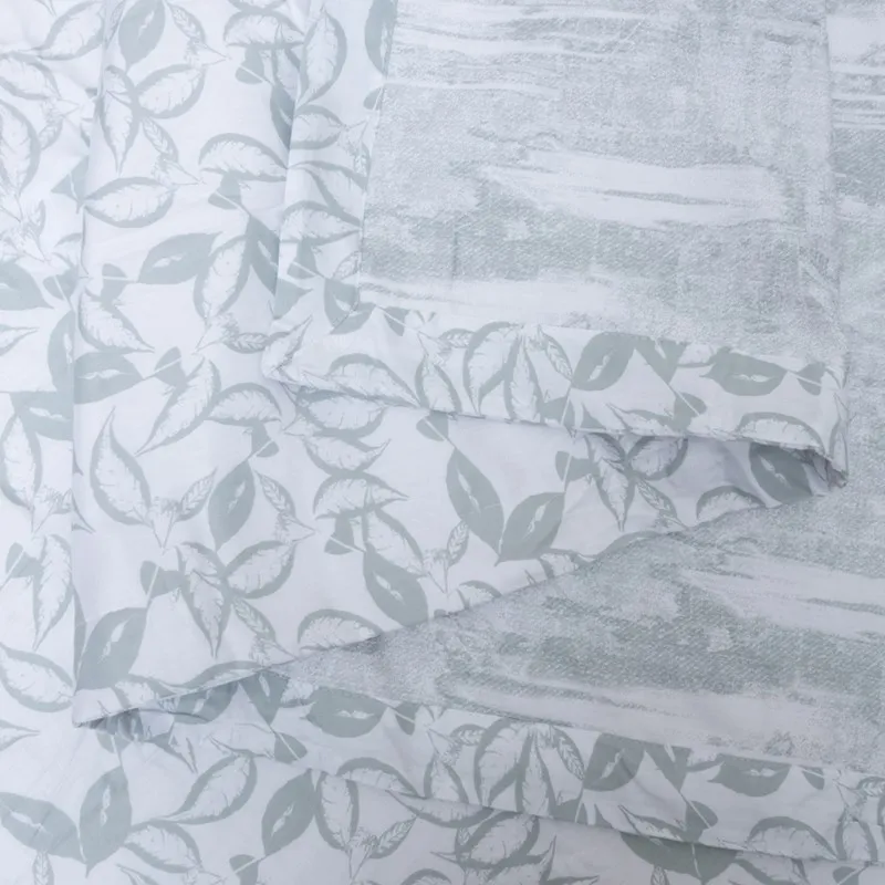 Folded dohar showing both leafy and abstract printed sides.