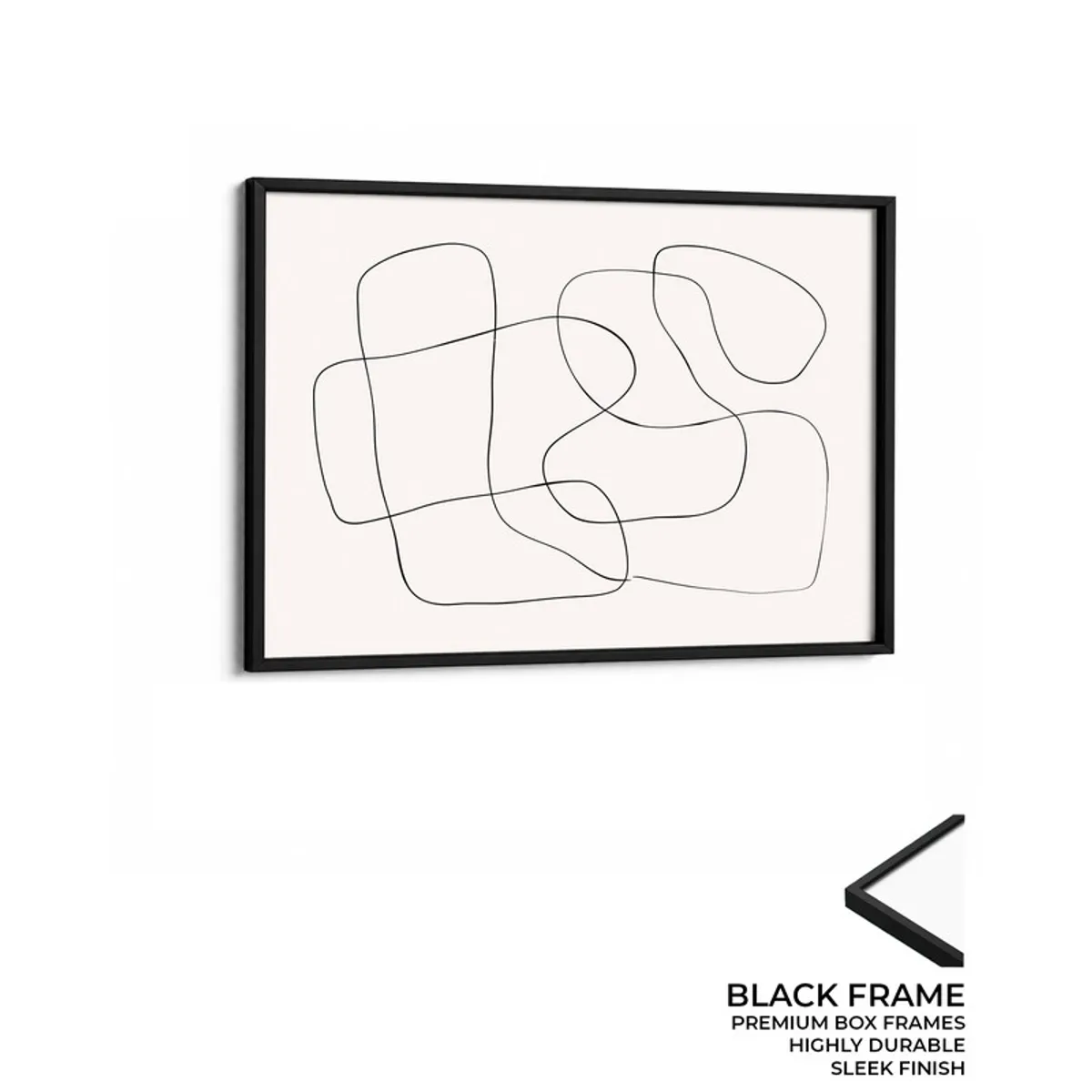 Black framed abstract line canvas wall painting on a plain white wall