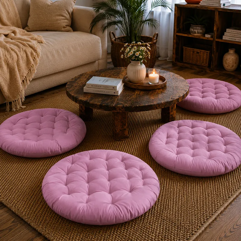 Four round lilac floor cushions placed around a low coffee table in a cosy living room.