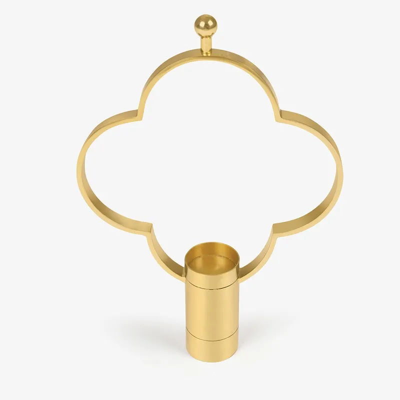 Front view of gold candle holder with rounded four-lobed frame