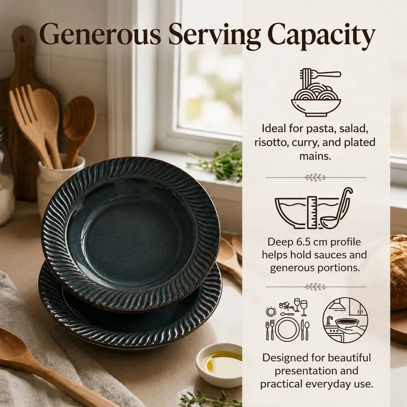 Stacked dark blue pasta plates styled with food and kitchen accessories