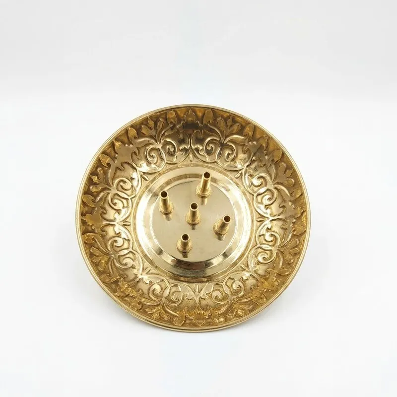 Round gold-toned brass incense holder with embossed decorative detailing