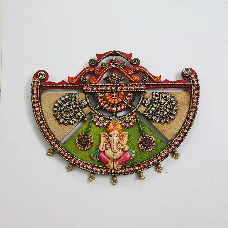 Front view of an ornate semi-sphere Ganesha wall accent in multicolour