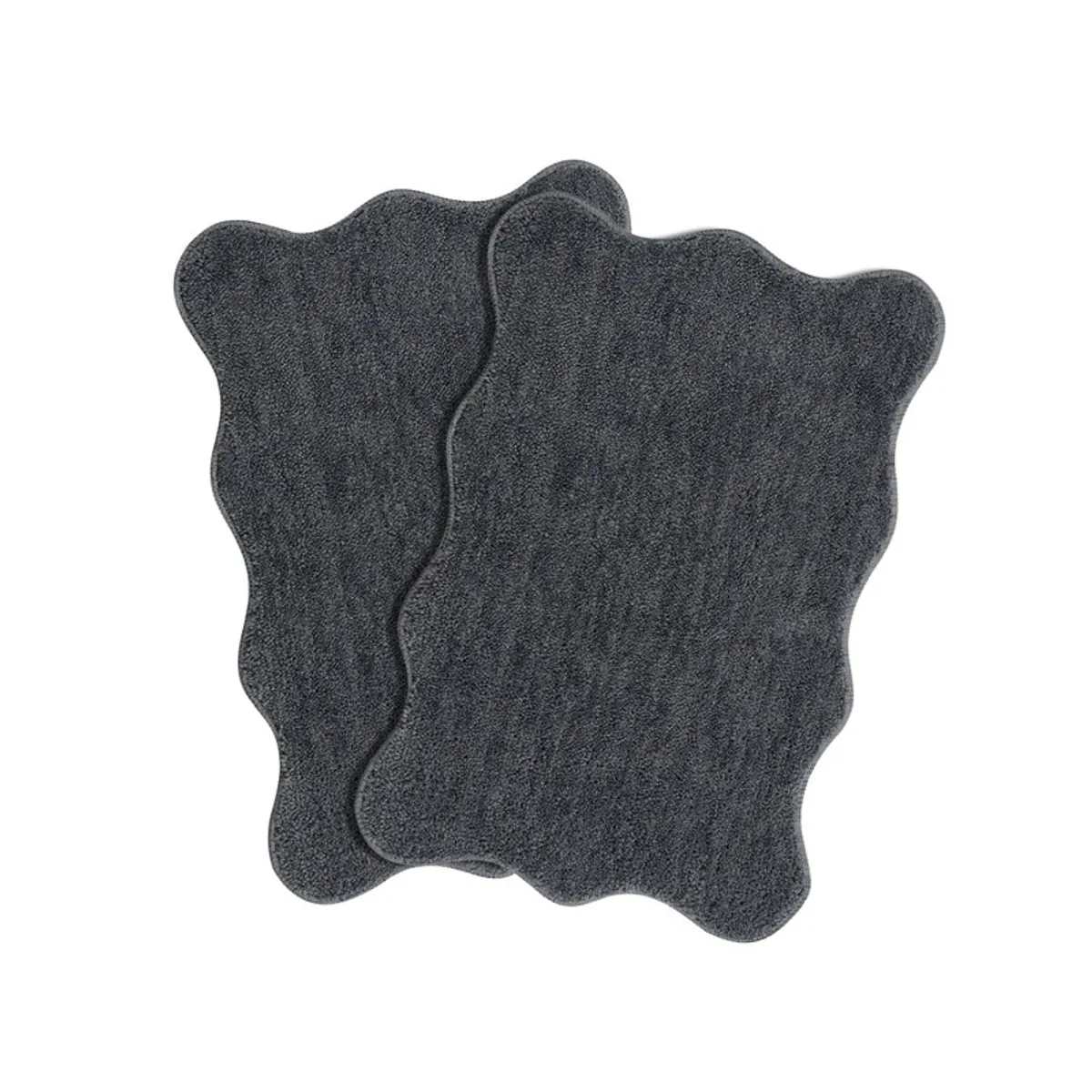 Two charcoal grey scalloped-edge bath mats shown overlapping on a white background