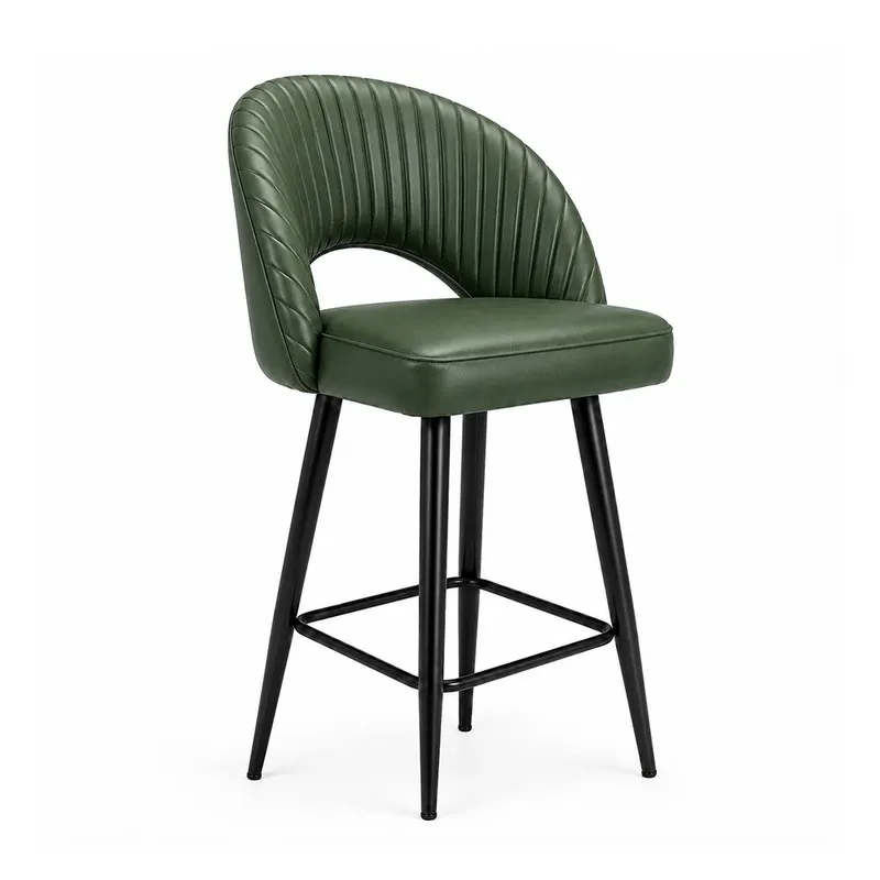 Angled view of dark green ribbed bar chair with curved back