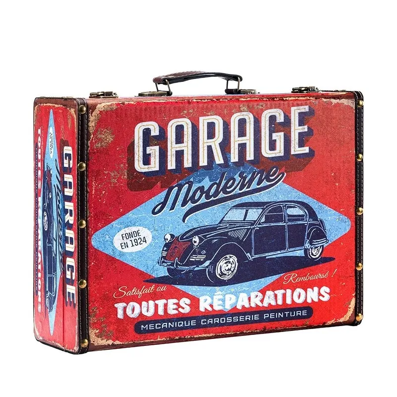 Front three-quarter view of a red garage-themed storage trunk with vintage car artwork