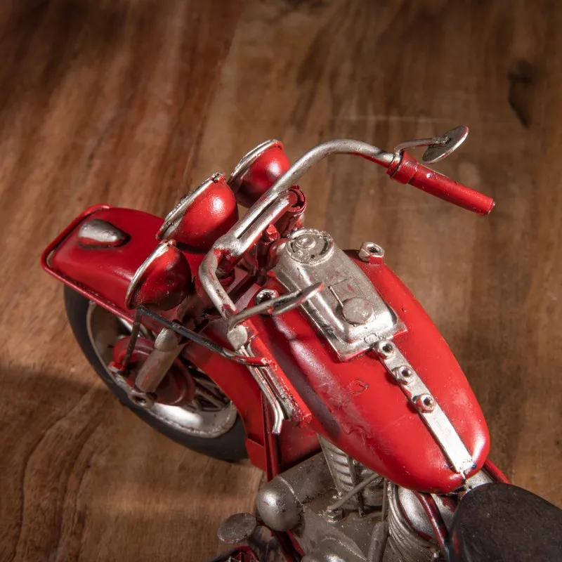 Top angled view of red motorcycle showpiece with silver detailing