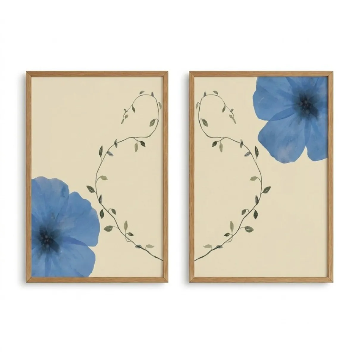 Two matching framed floral wall paintings with blue flowers on a light background