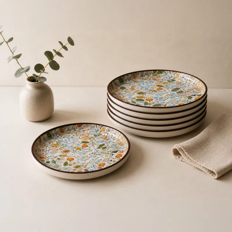 Six floral quarter plates with one plate placed separately