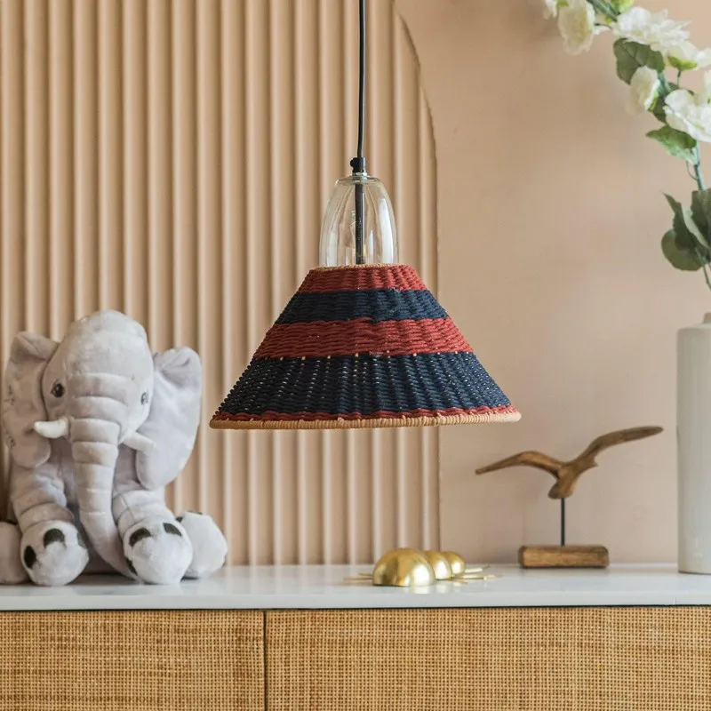 Red and black striped pendant lamp above a console table