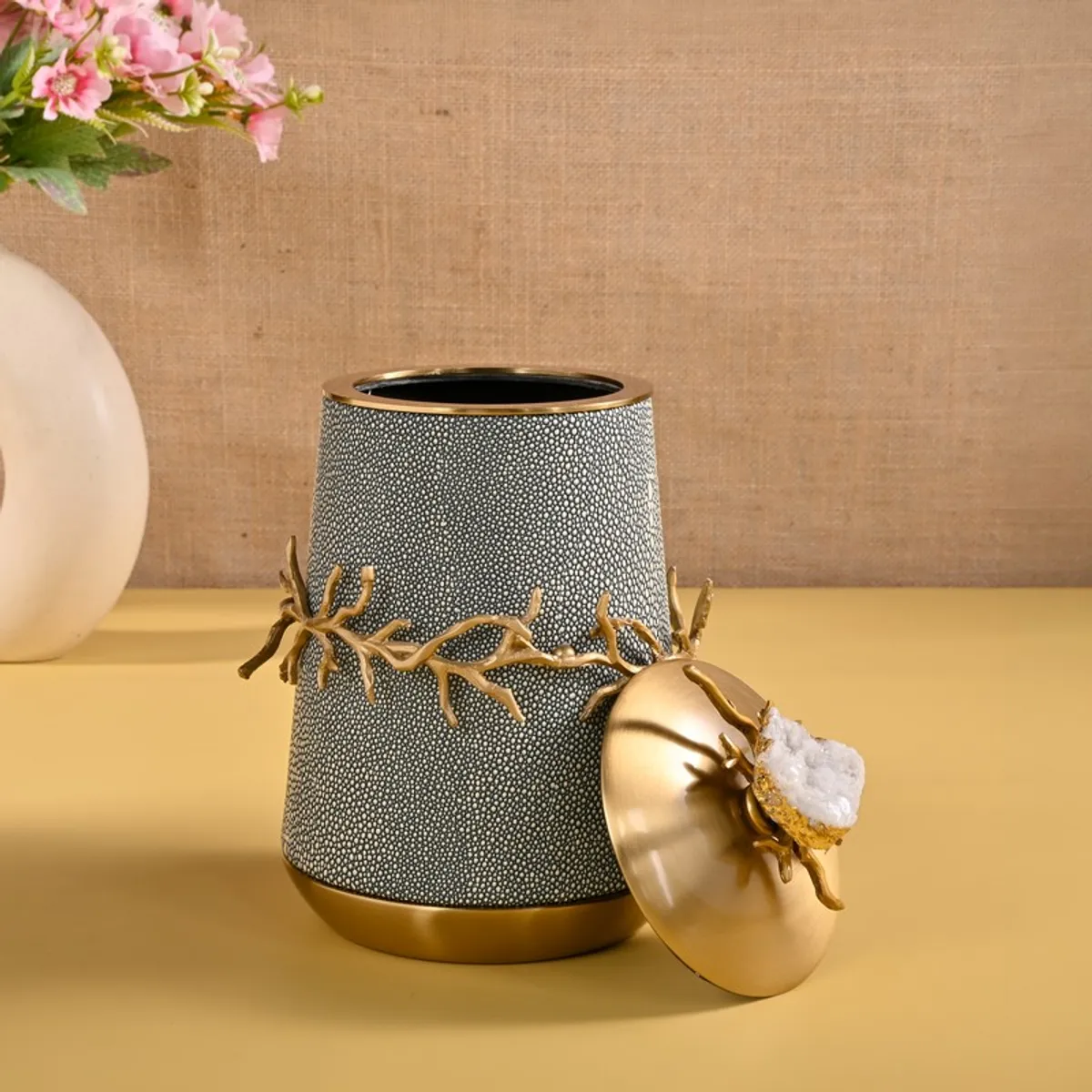 Open blue and gold decorative showpiece with lid placed beside it