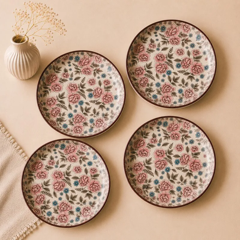 Top view of four round floral quarter plates arranged separately