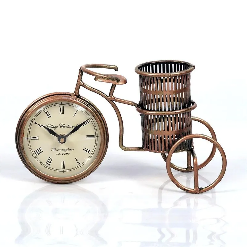 Bicycle-shaped metal pen stand with clock face on a white background