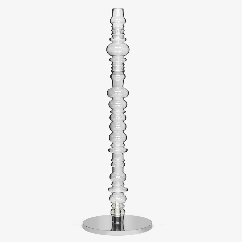 Front view of clear glass floor lamp with circular silver base